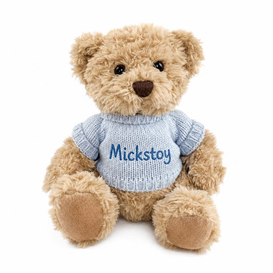 Mickstoy cream teddy bear plush toy wearing a blue knitted sweater on white background